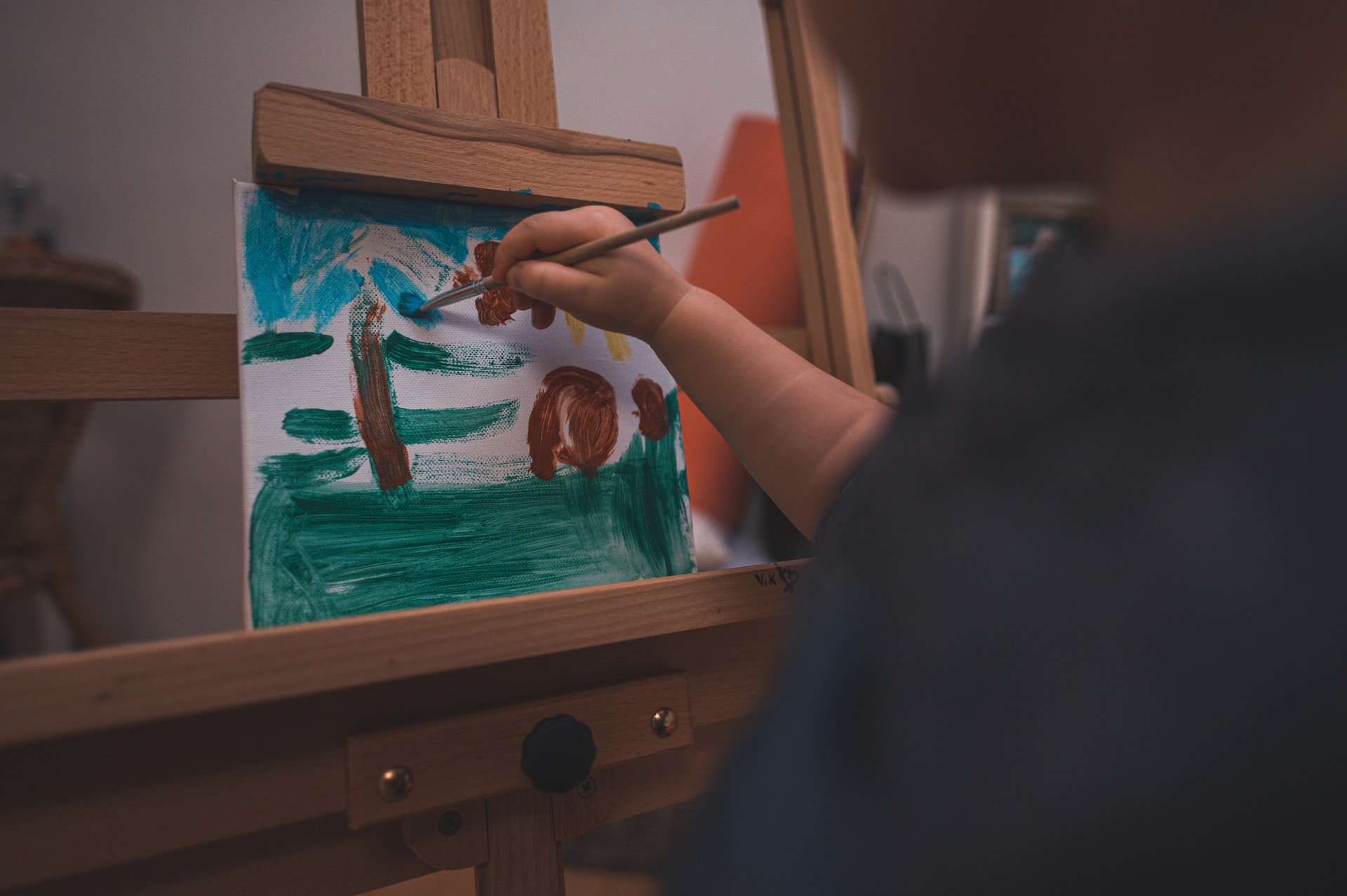 A hand painting on an easel